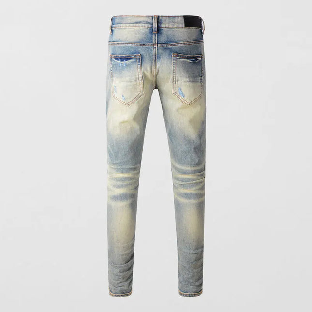 Fashionable new jeans with stretch, slim fit, ripped holes, patchwork leather, red patches, washed with water, nostalgic retro,